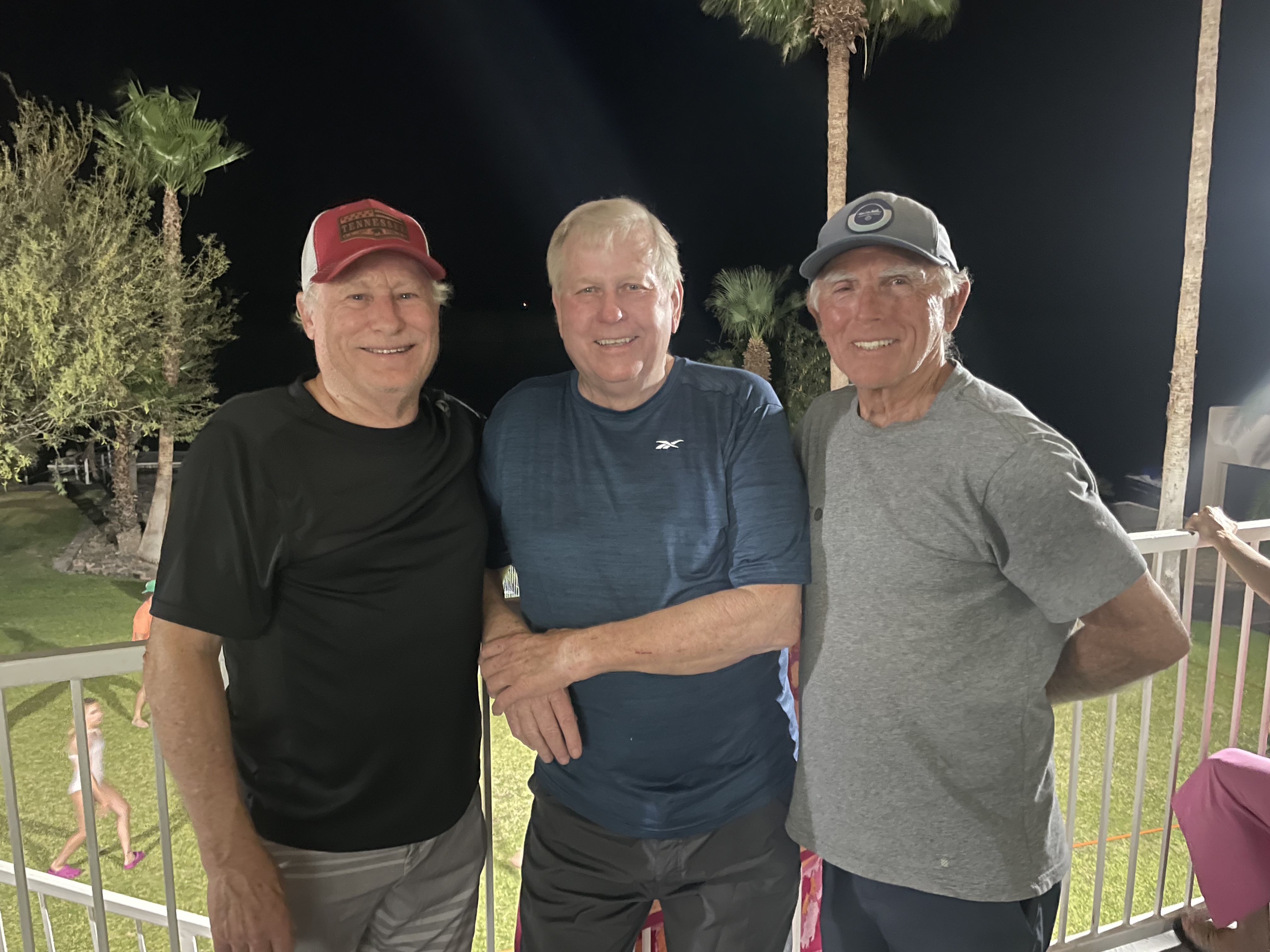 Ed standing outdoors with two longtime friends